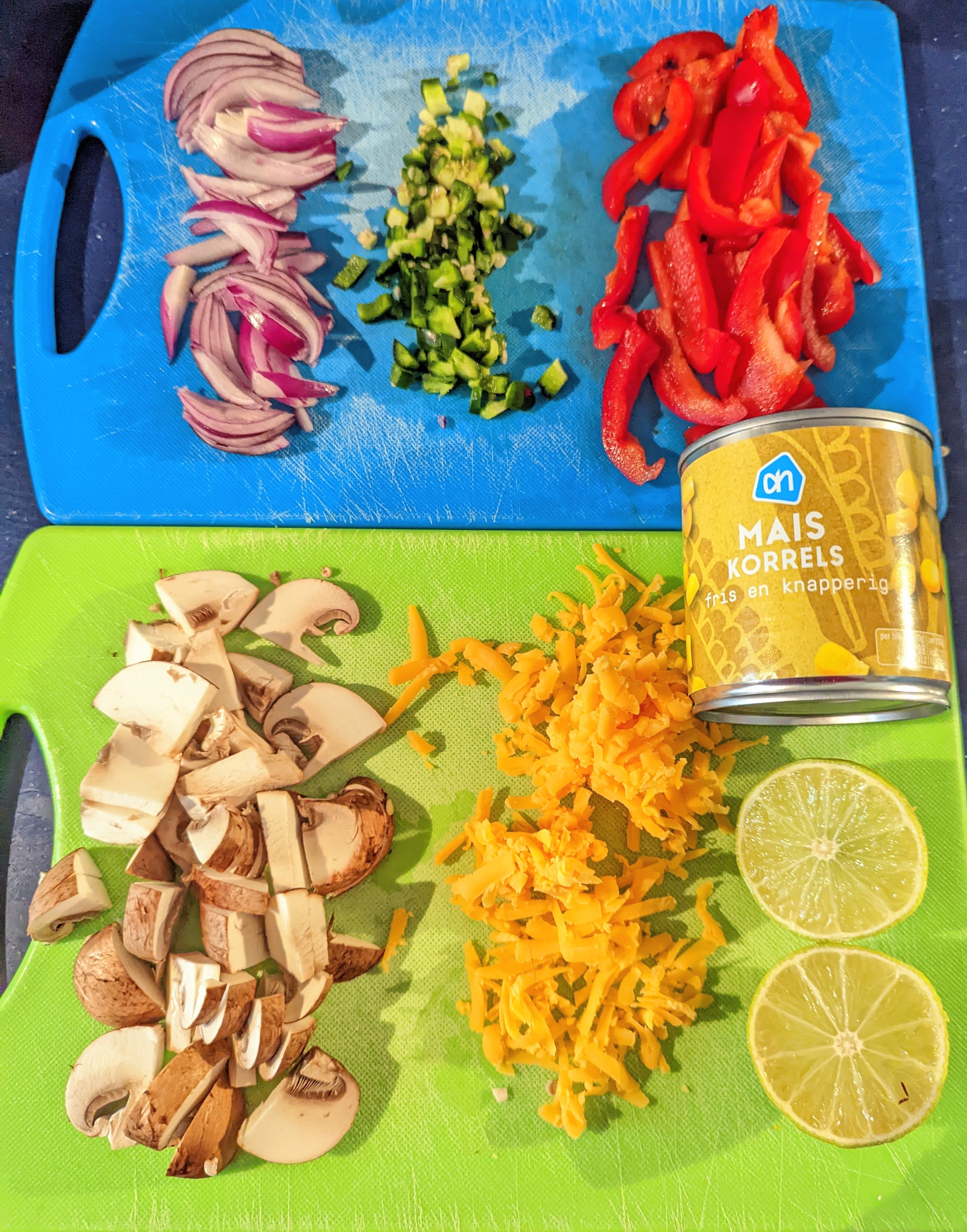 picture of the prepared incredients, cut veggies, can of corn